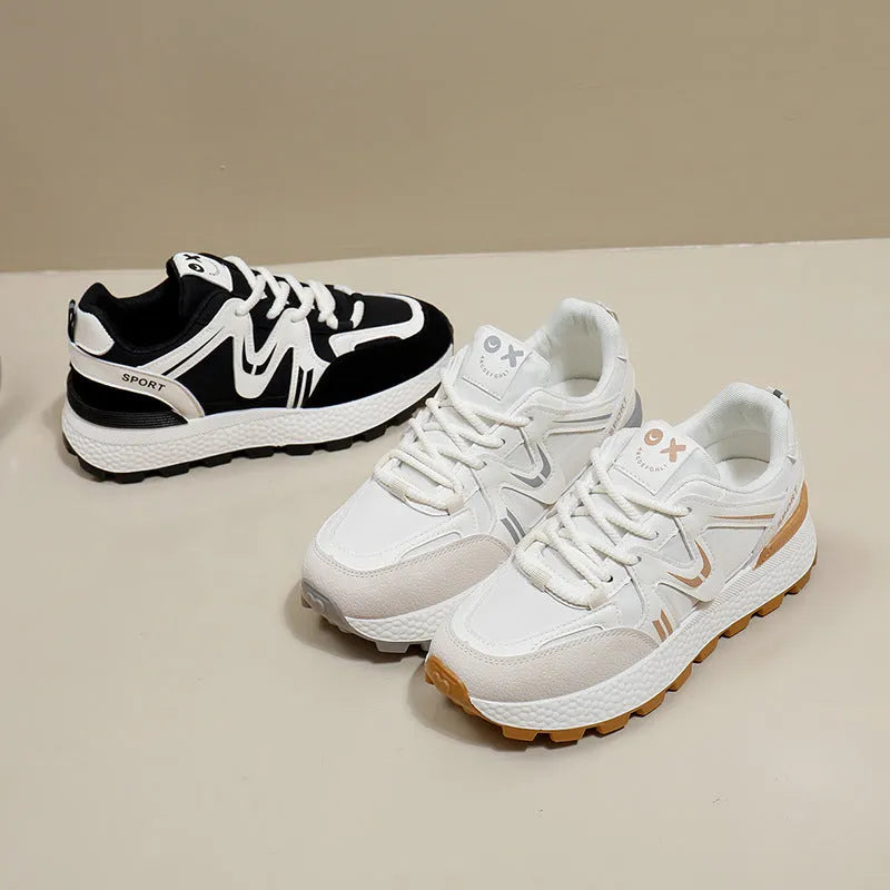 Women's black platform sports casual shoes with round toe and front lace-up closure on flat background