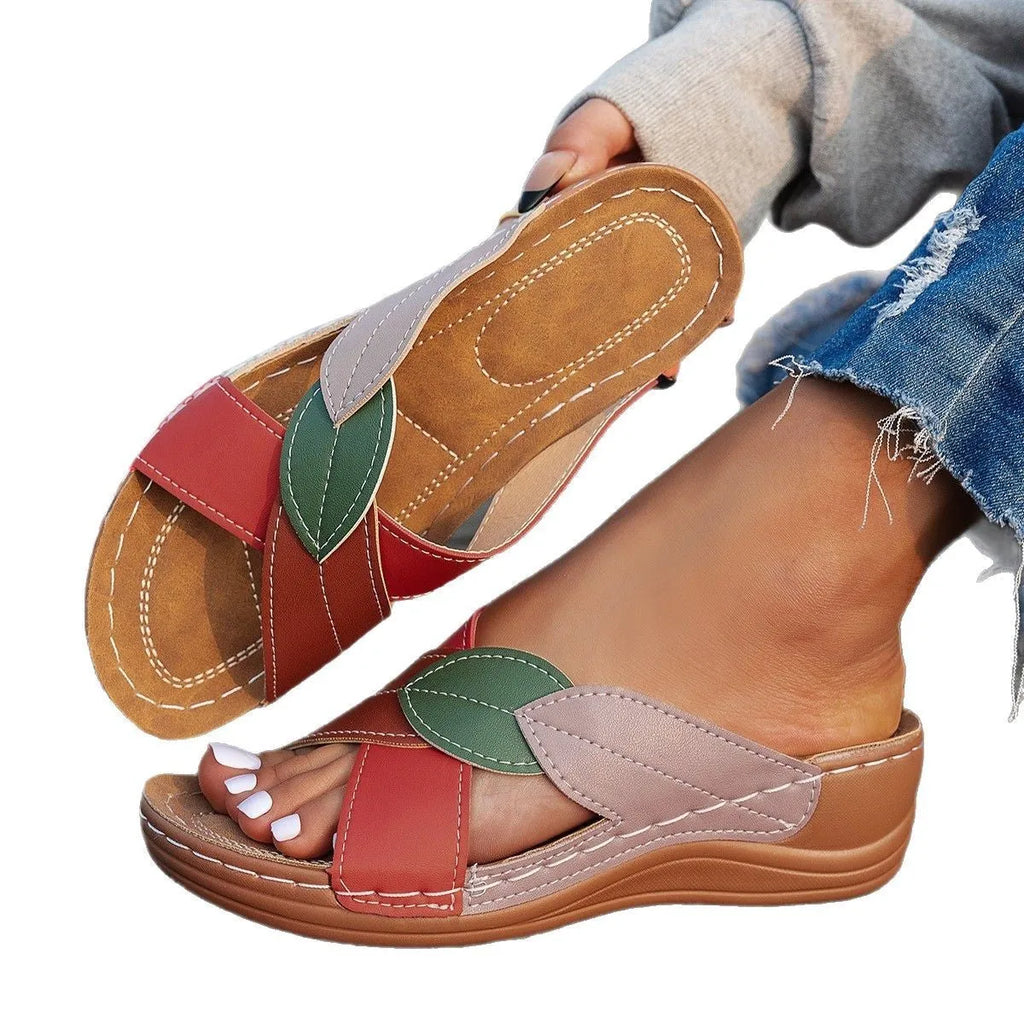 Women's black thick-soled slippers with cross-straps and peep-toe design