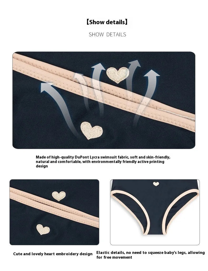 Dark blue split colour baby girls' swim briefs made from polyester and Lycra fabric.