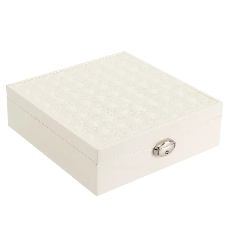Red and white jewellery storage box with compartments for necklaces and rings