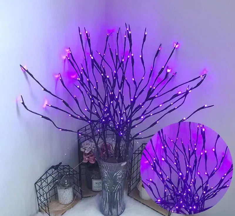 LED lantern simulation branch light in a vase with silver-painted branches glowing in a chosen colour.