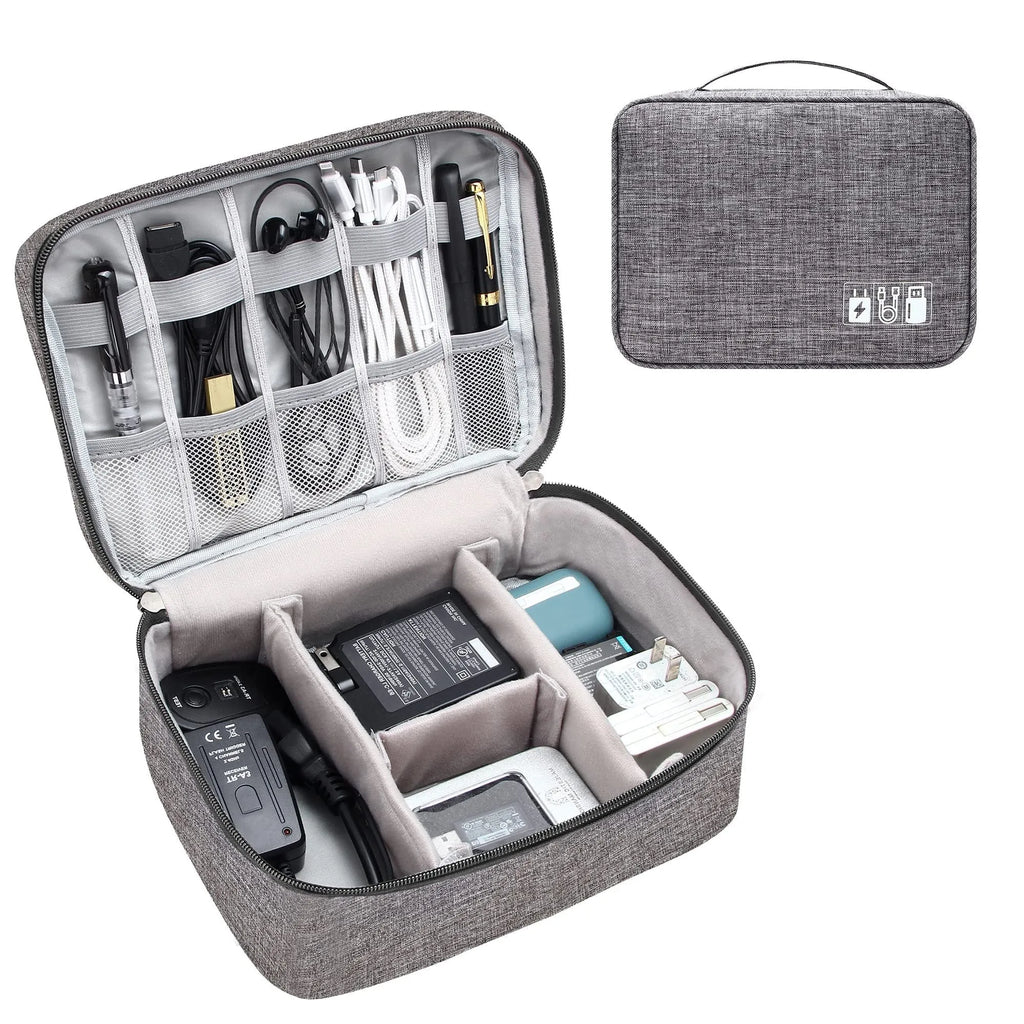 Black waterproof electronics organiser case open, showing mesh pockets, elastic loops, and removable padded dividers inside.