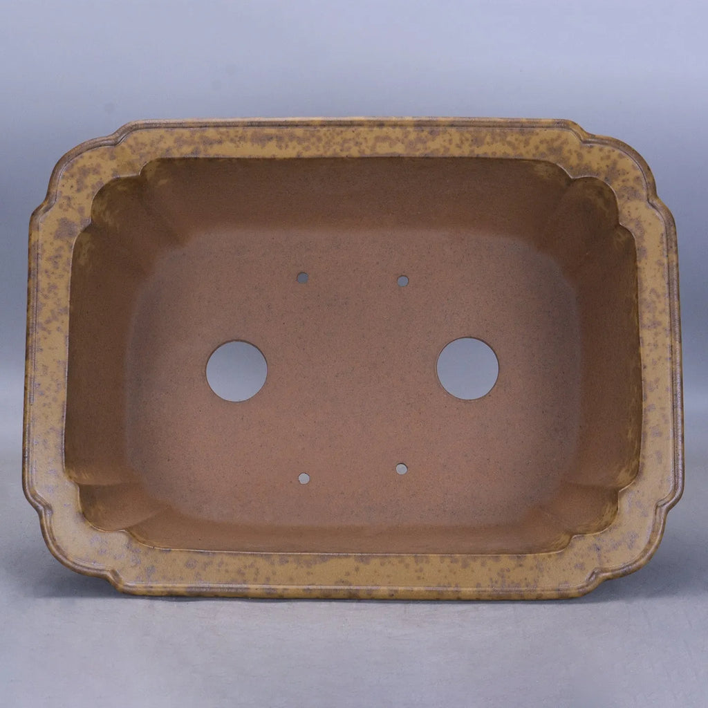 Purple sand rectangular flowerpot showing textured segment mud construction and geometric angles.