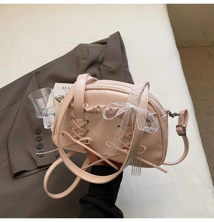 Women's fashion handbag with bandage bow design and mobile phone compartment in selected colour