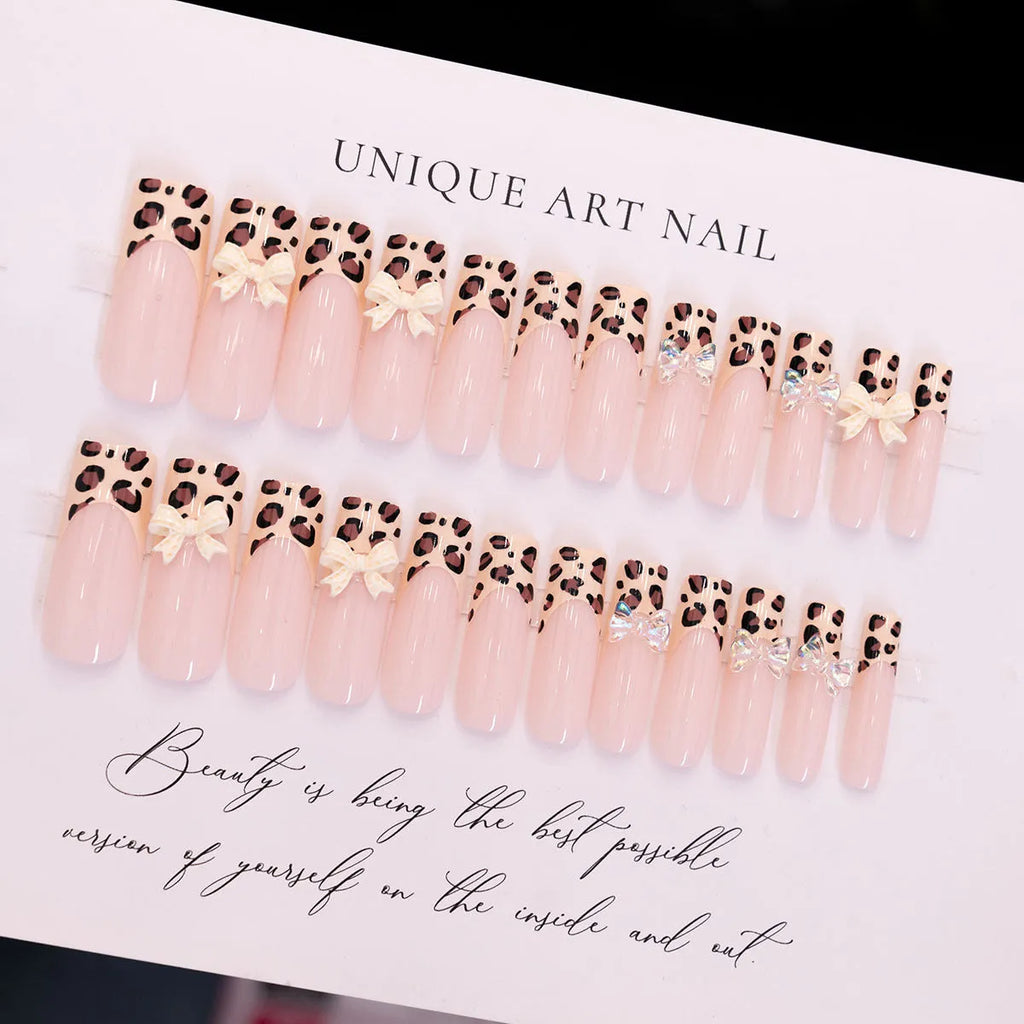 Leopard print butterfly designs on plastic false nails in WM296 colour for ladies manicure