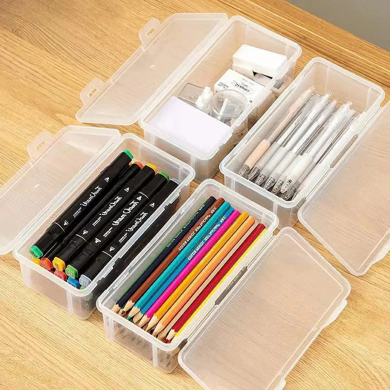 Transparent plastic stationery storage box containing pencils and coloured art supplies