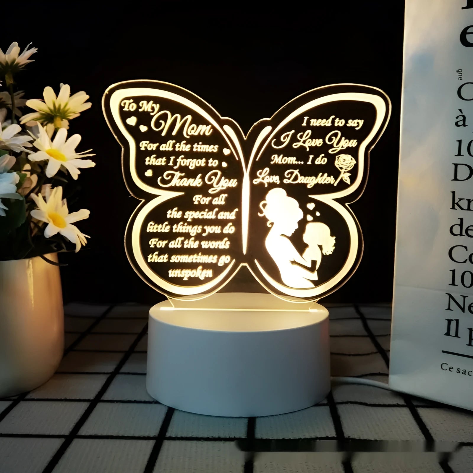 White heart-shaped acrylic table lamp with touch control base on a wooden surface