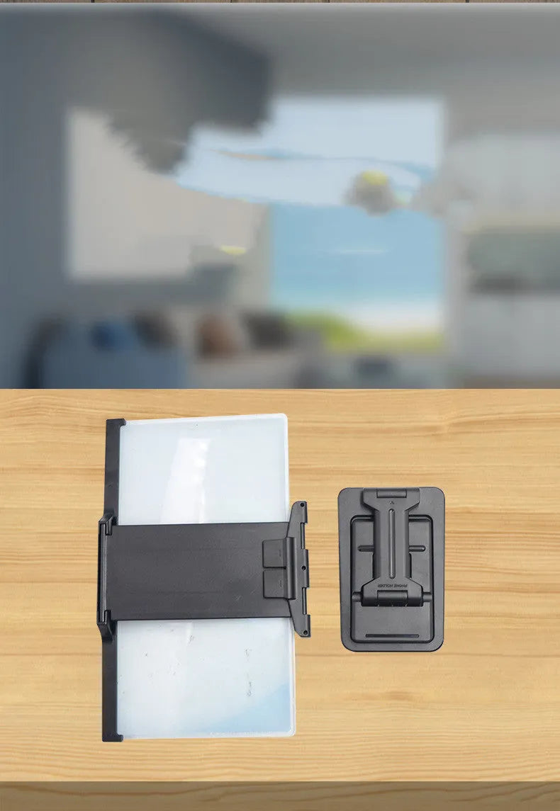 Black folding mobile phone screen amplifier with detachable holder showing 12-inch curved display