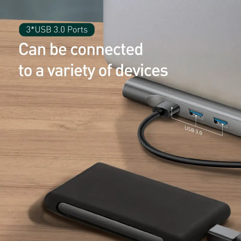Gray aluminium USB C hub docking station with cooling bracket showing 10 ports including HDMI and Ethernet