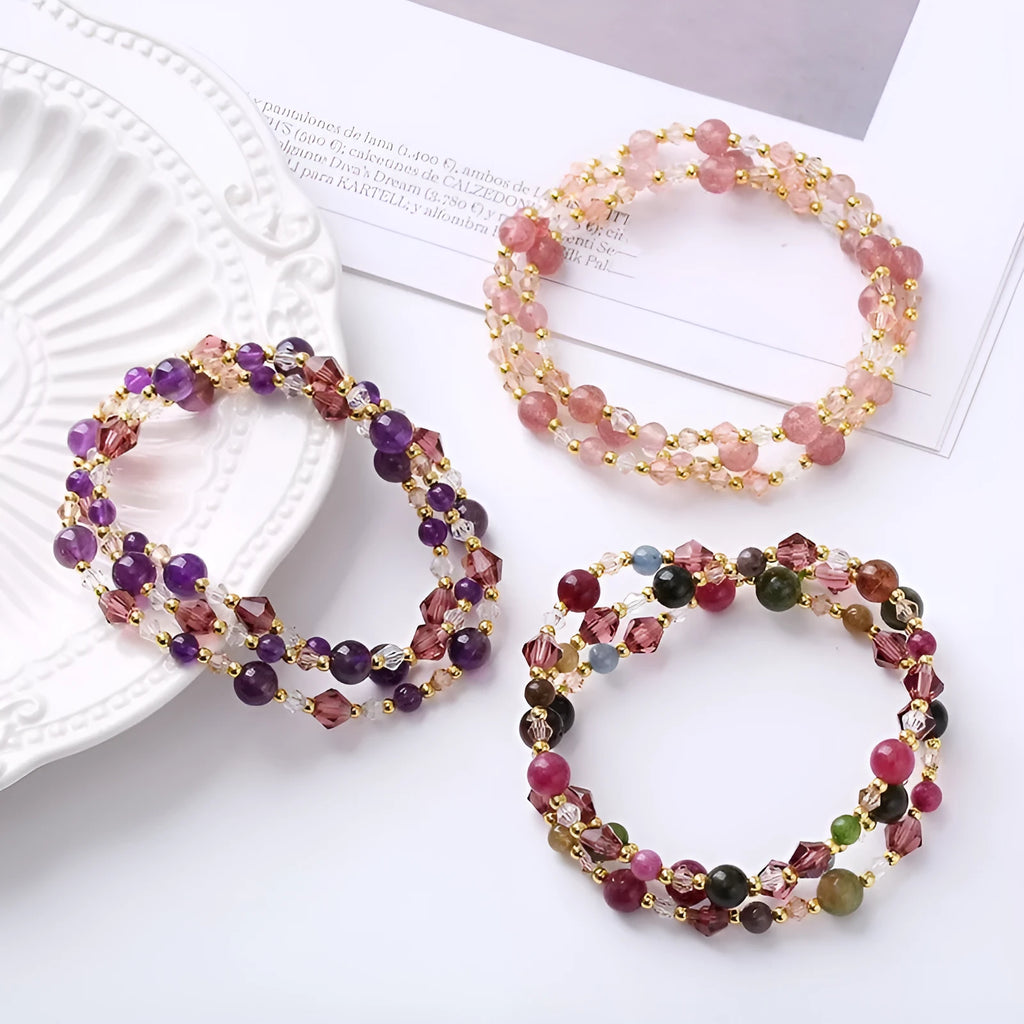 Women's adjustable bracelet with three rings of tourmaline, strawberry quartz or amethyst crystal beads on knotted cord
