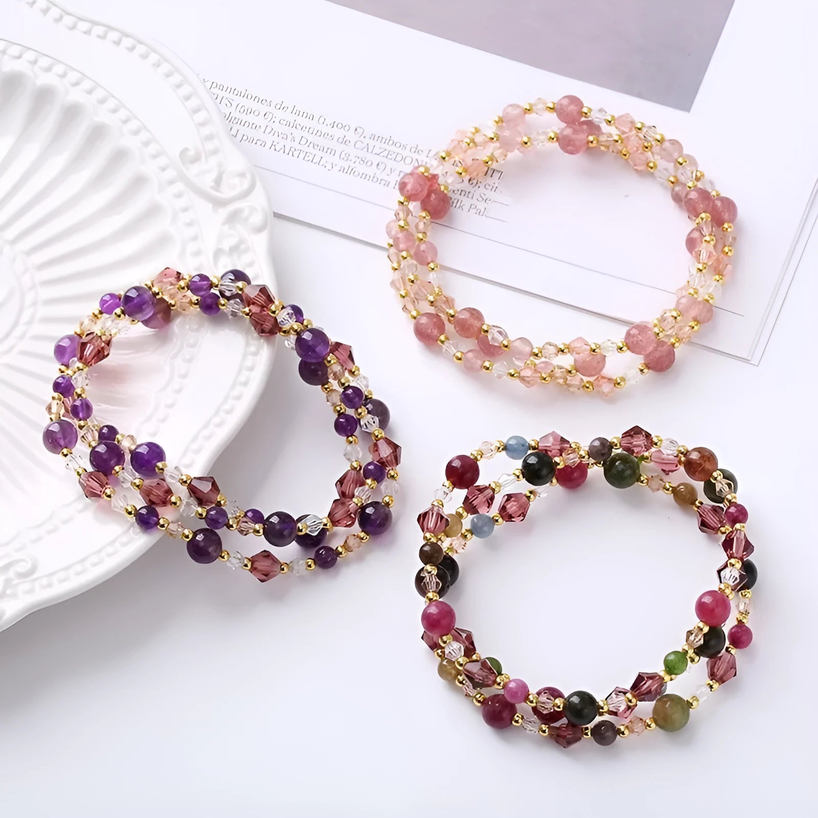 Women's adjustable bracelet with three rings of tourmaline, strawberry quartz or amethyst crystal beads on knotted cord