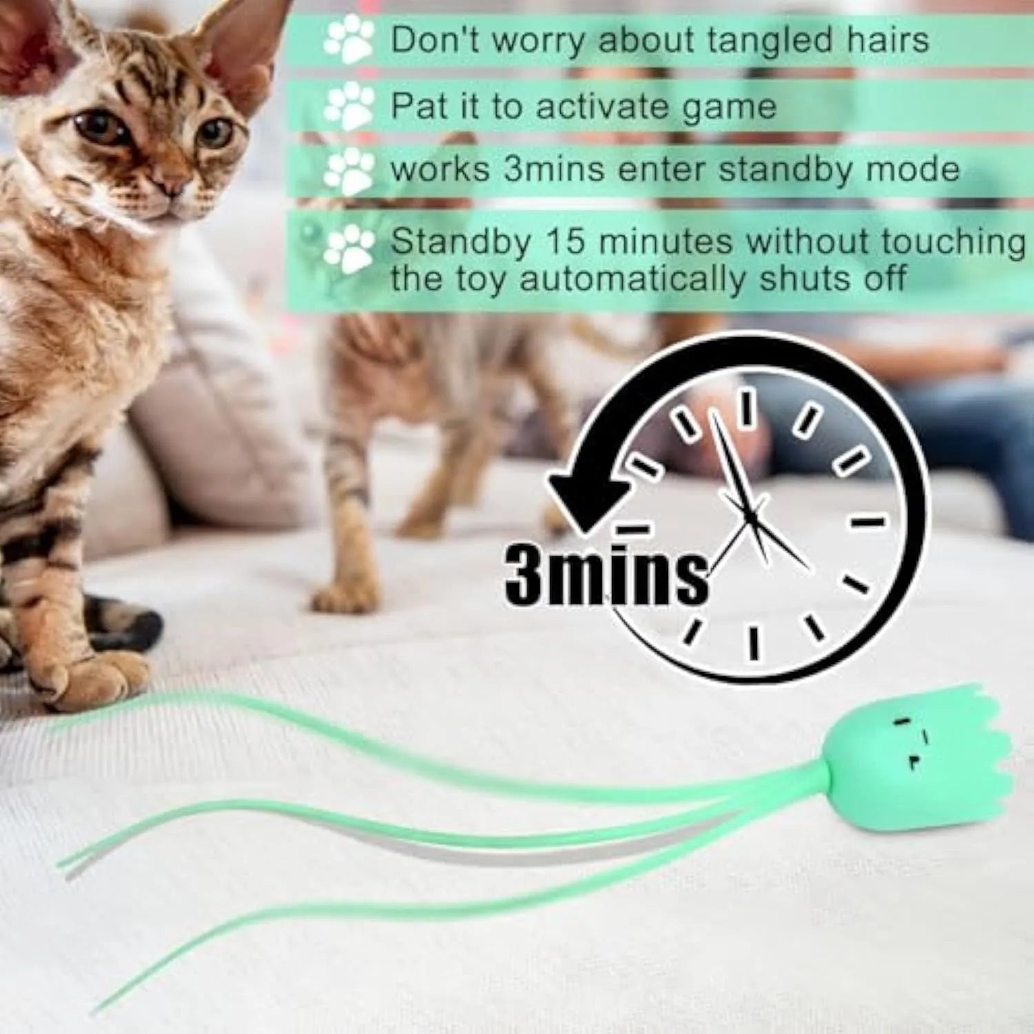 Green automatic electronic cat wand toy with swinging silicone tails on a table.