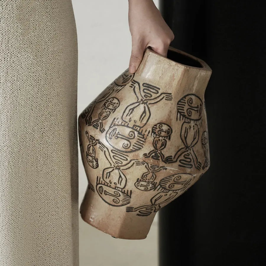 Ceramic vase with hand-painted vintage carved tribal totem art in religious symbolic patterns