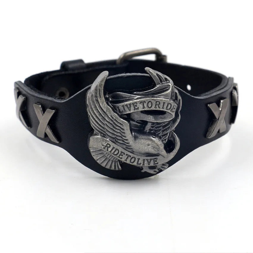 Black geometric leather bracelet with Eagle watch-button detail, showing tapered width.
