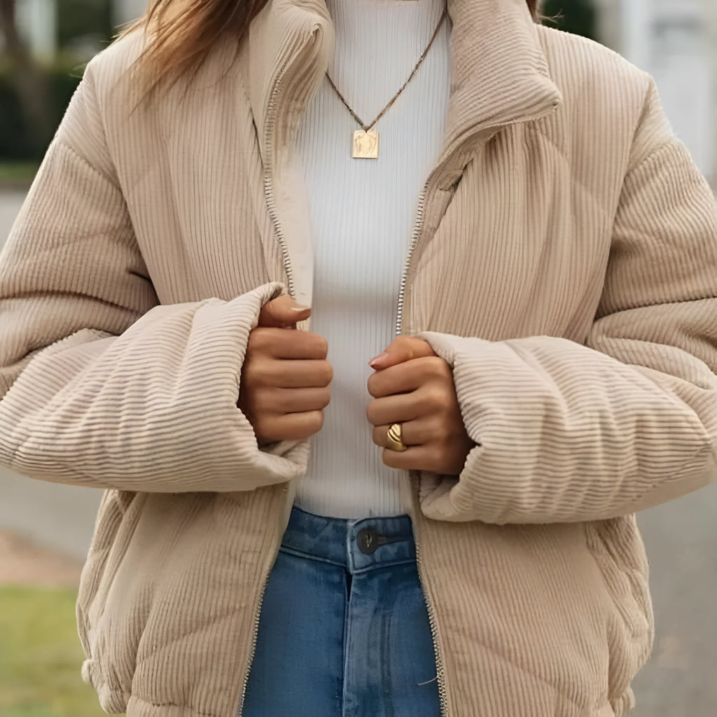 Apricot women's corduroy zip jacket with a stand collar and long sleeves.