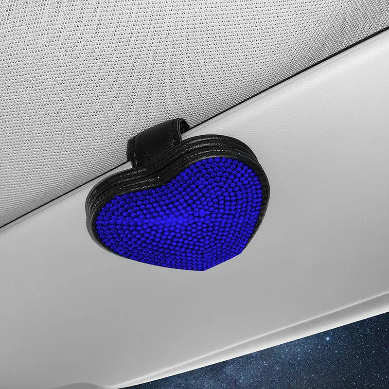 Diamond decorated PU leather magnetic clip for car sun visor holding sunglasses.