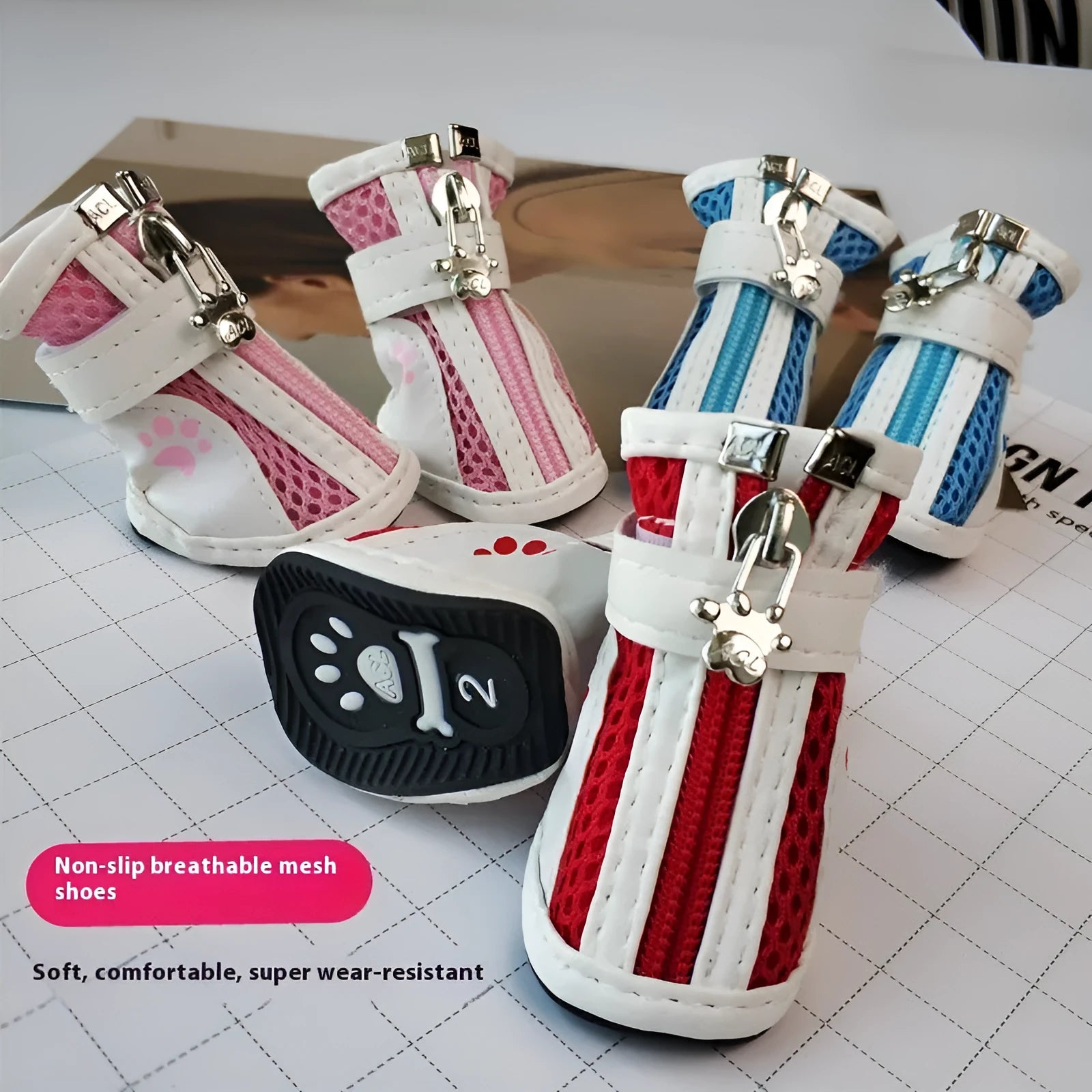 Set of four blue cloth dog shoes with zipper closures and non-slip soles for small pets.