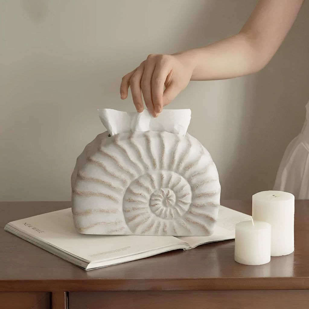 Modern simple resin tissue box cover with decorative conch ramble pattern.