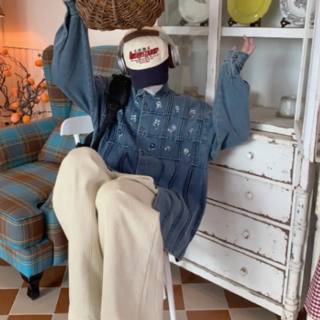 Vintage washed blue denim shirt with small floral embroidery and pleated front panel
