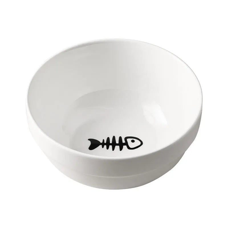 White ceramic cat food bowl with cat paw print design on black iron frame stand