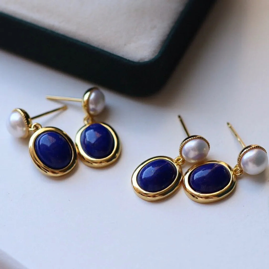 Silver earrings with blue lapis lazuli pearls and auspicious pattern details