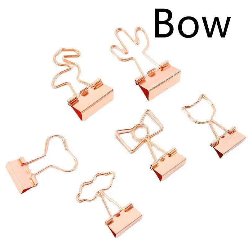 Gold metal decorative paper clip showing flamingo, love, cloud, cat, cactus, and bow shape options.
