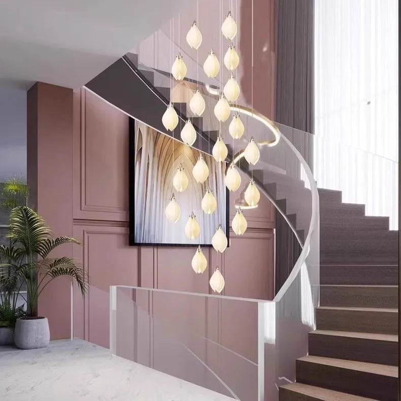 Ceramic magnolia petal-shaped single head pendant light with a dimmable fitting against a neutral background.