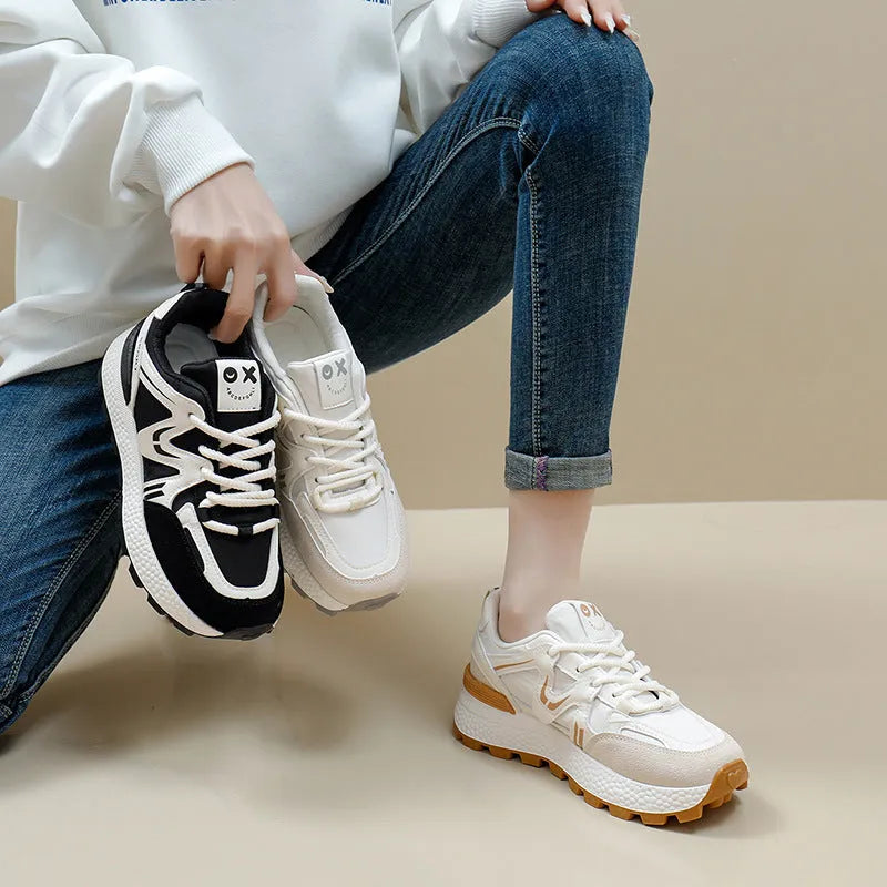 Women's black platform sports casual shoes with round toe and front lace-up closure on flat background