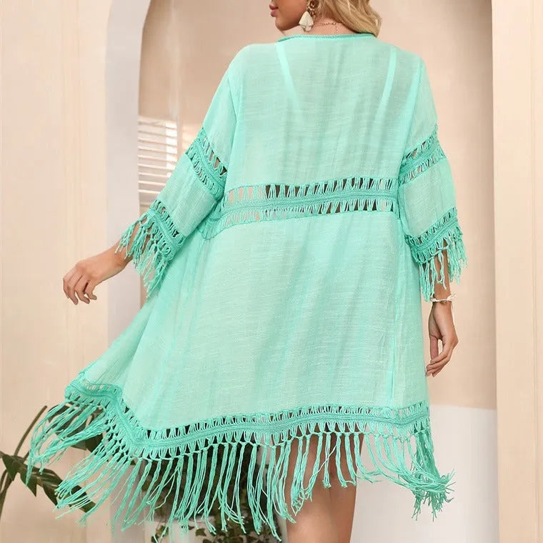 Yellow hand crocheted women's cardigan with tassels, a beach cover-up.
