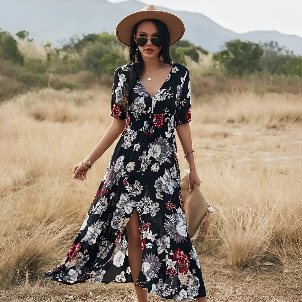 Yellow floral print women's summer dress with V-neck and elastic waist on a hanger