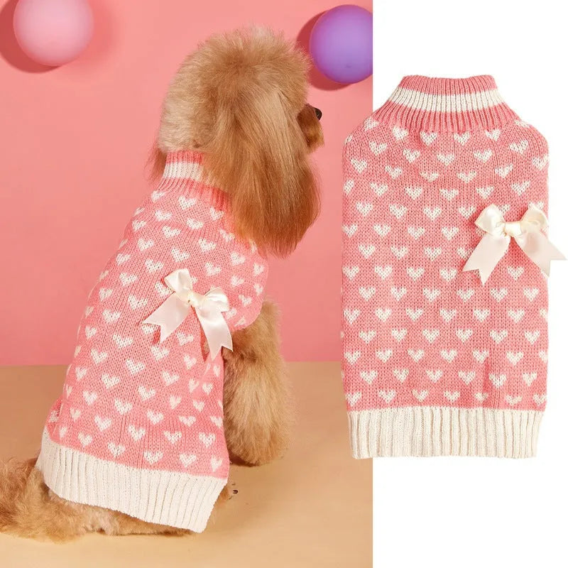Red love heart design on a pink acrylic dog sweater for a small dog.