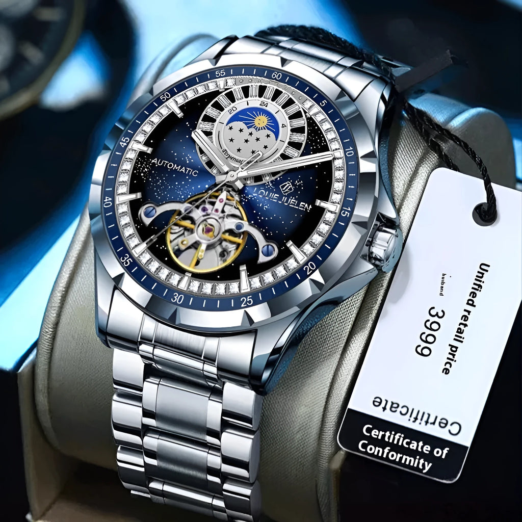 Men's silver automatic mechanical watch with blue dial, stainless steel strap, and transparent case back showing movement