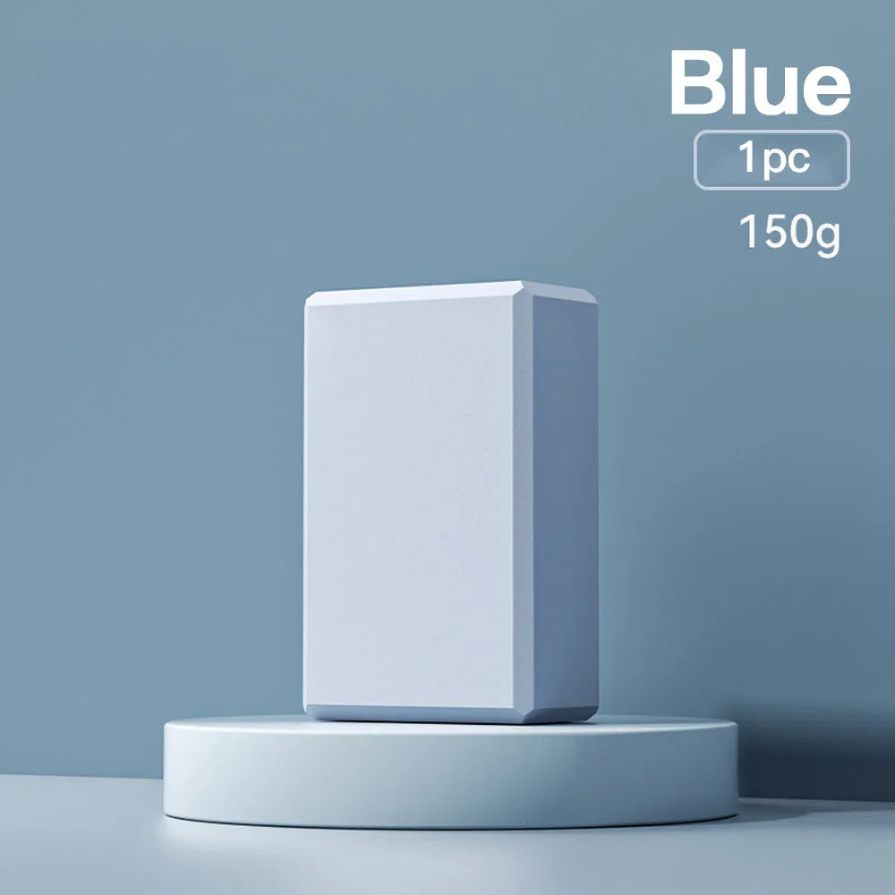 Solid-colour EVA foam yoga block measuring 23x15x7.6cm with grip ridges