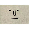 Square PVC floor mat with cartoon face design and geometric pattern in Mr. Big Nose colour