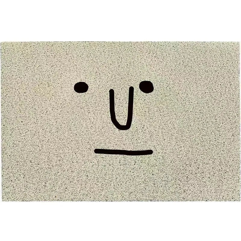 Square PVC floor mat with cartoon face design and geometric pattern in Mr. Big Nose colour