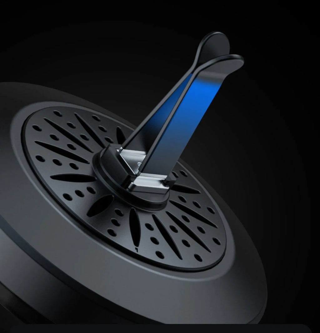Car air vent aromatherapy diffuser with multicolour RGB lighting mounted in vehicle vent