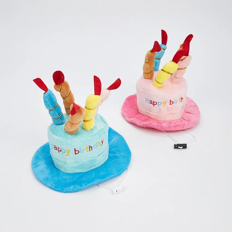 Blue and pink coloured toy birthday hat for dogs on a white background.