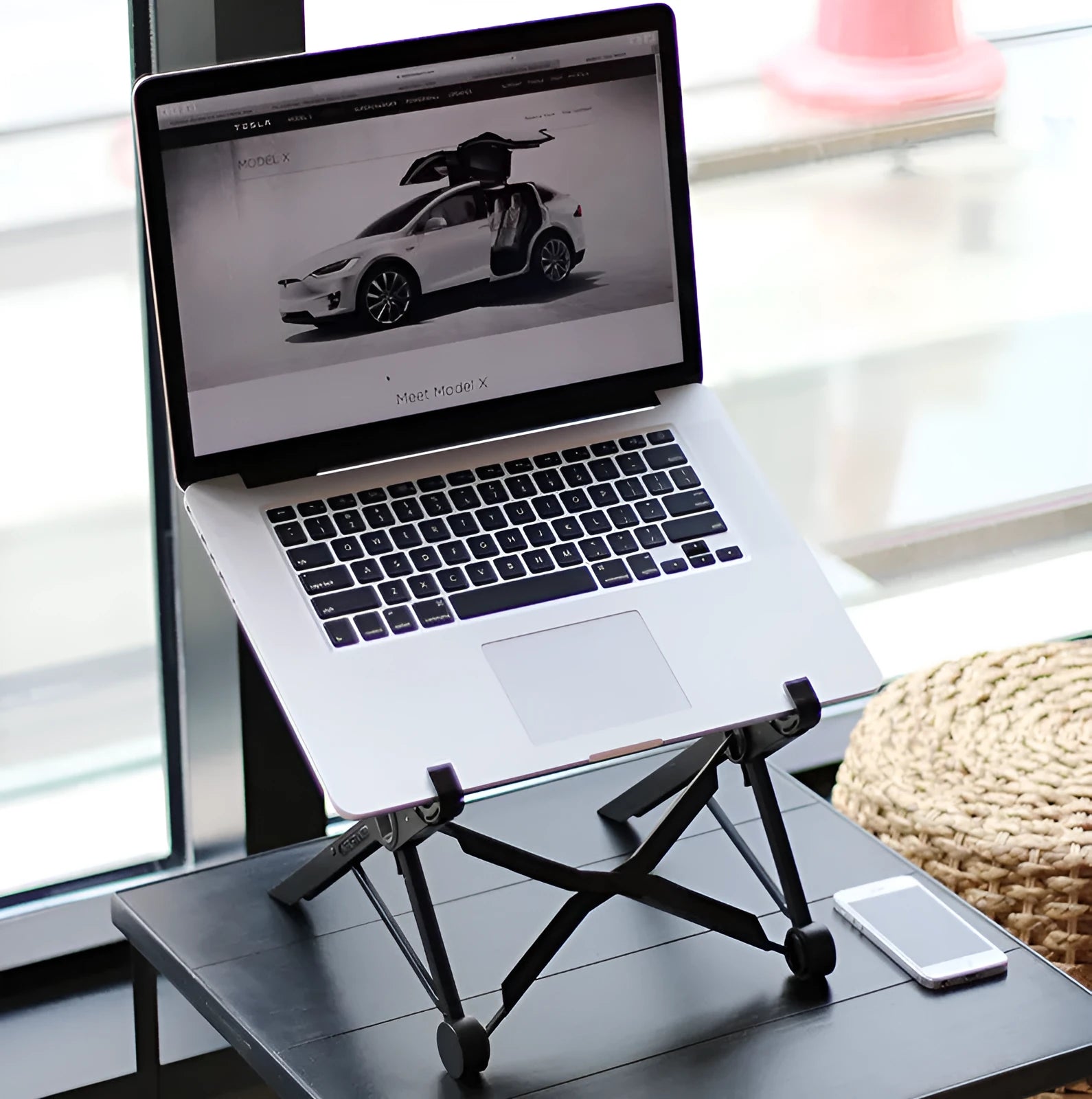 Black folding portable laptop stand with adjustable height, shown folded to 35.4cm size.