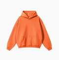 A man wearing a loose-fit, 450g cotton, hooded pullover sweater in a neutral colour with drop-shoulder sleeves.