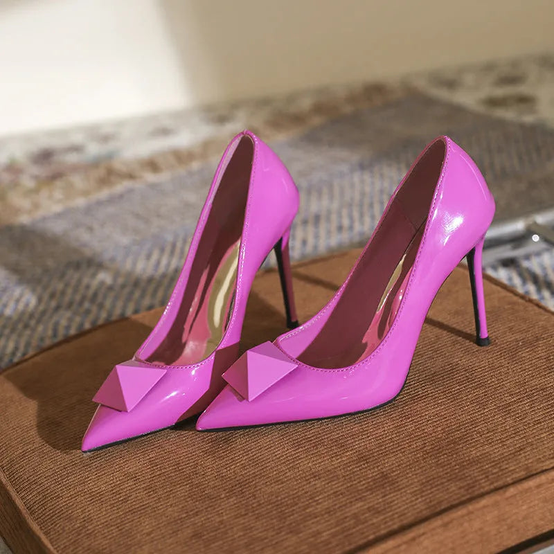 Pink pointed toe stiletto heels for women with patent leather upper and buckle detail