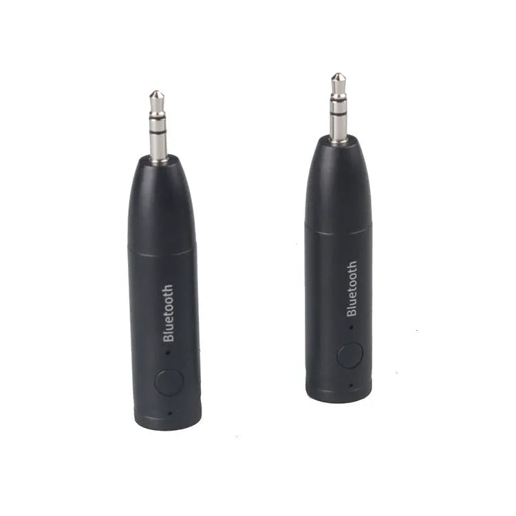 Black Bluetooth audio receiver with 3.5mm jack and USB charging port for car stereo connection