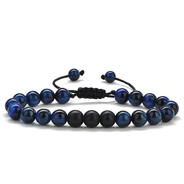 Matte black agate tiger eye bead couple bracelets with geometric design on a neutral background.