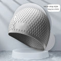 Silicone swimming cap with water drop texture in various colours for adults.