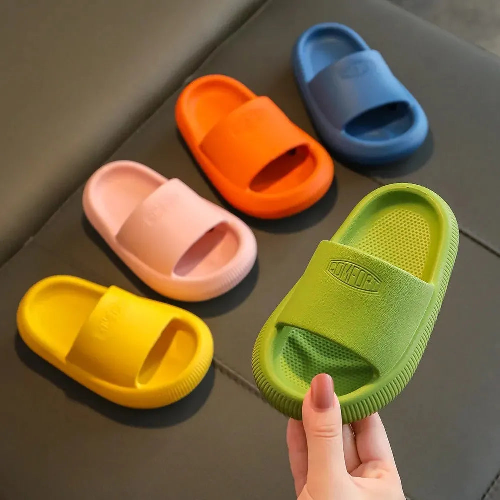 Colourful children's EVA slippers with a thick, textured non-slip sole in various sizes.