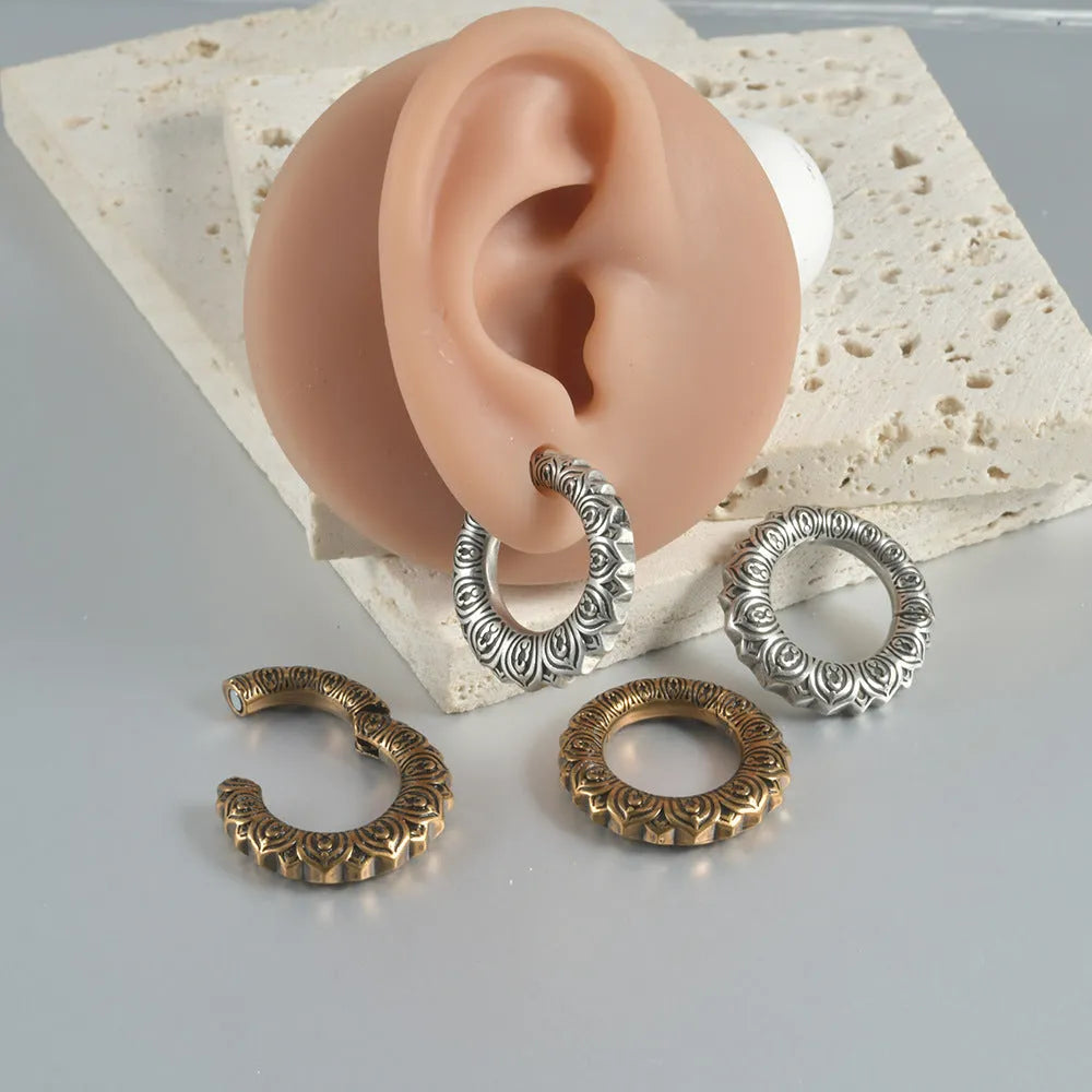 Geometric hollow-out stainless steel earrings with large copper auricle shape in antique silver dragon finish.