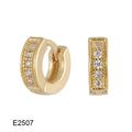 A pair of heart-shaped clip earrings with a single zircon stone in electroplated brass gold.