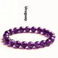 Natural amethyst scattered bead bracelet made from polished Uruguayan crystal in various sizes.