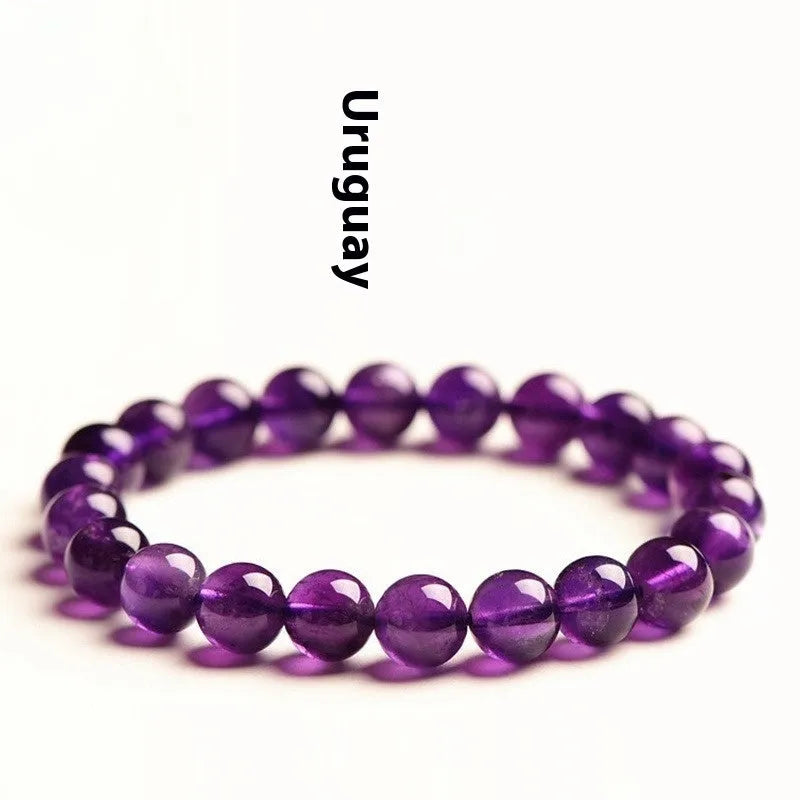 Natural amethyst scattered bead bracelet made from polished Uruguayan crystal in various sizes.