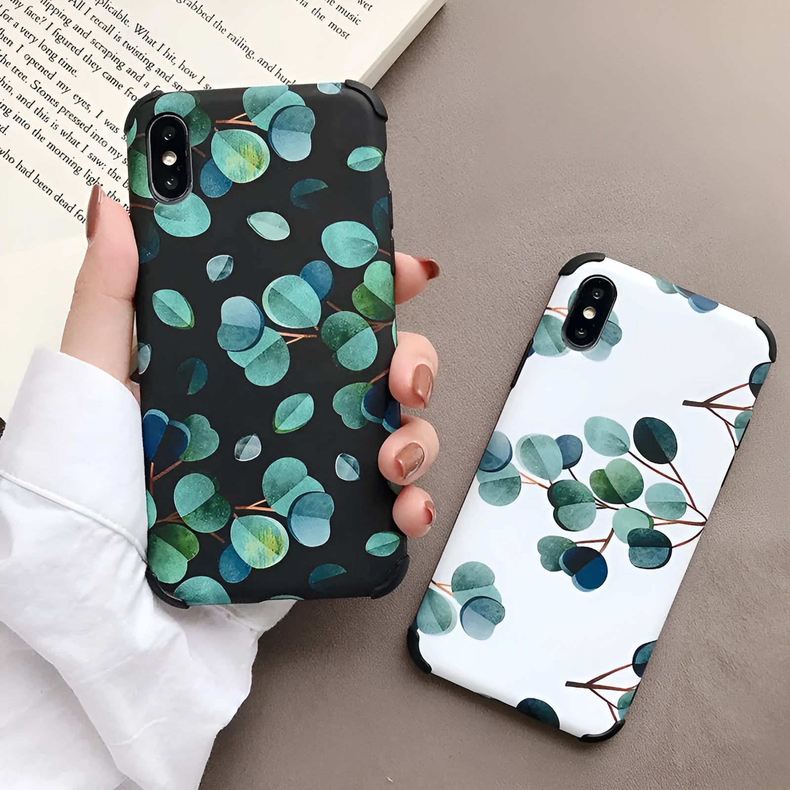 Black silicone iPhone case with a raised leaf pattern design on the back.