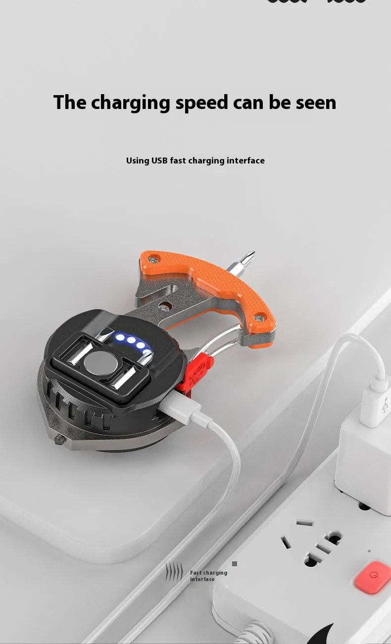 Compact silver and black multifunction keychain torch with window breaker tip and seven LED light modes.
